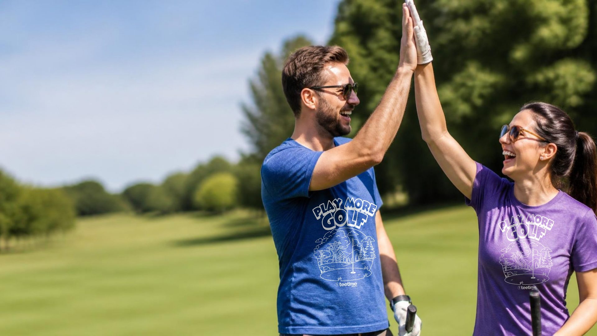 Two golfers in Play More Golf tees giving each other a high five on the course